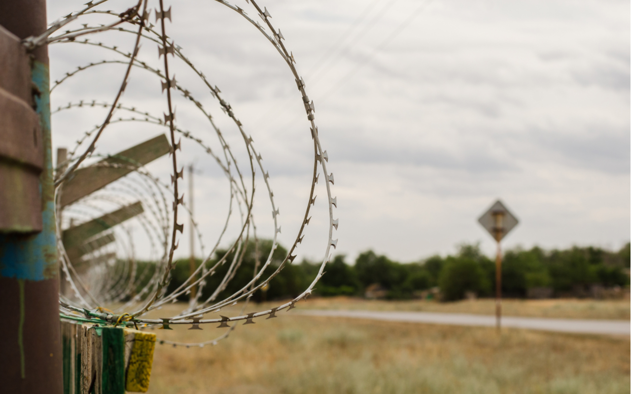barbed wire fence in a rural town