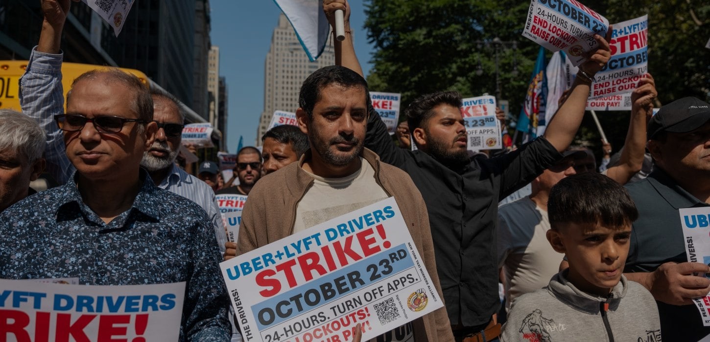Image of protestors at a rideshare drivers strike and rally