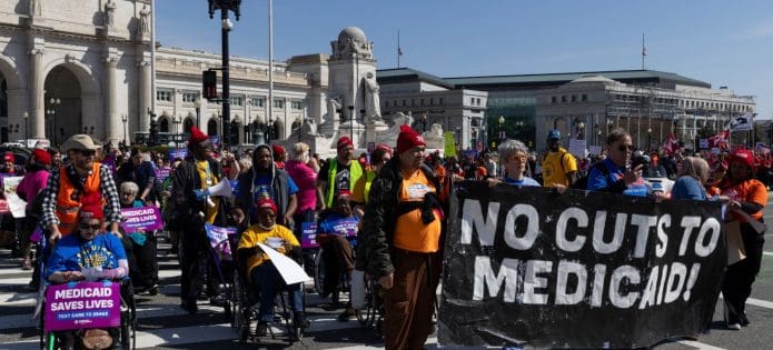 Demonstrators protest health care cuts at Washington, D.C.'s Union Station. (Shutterstock)