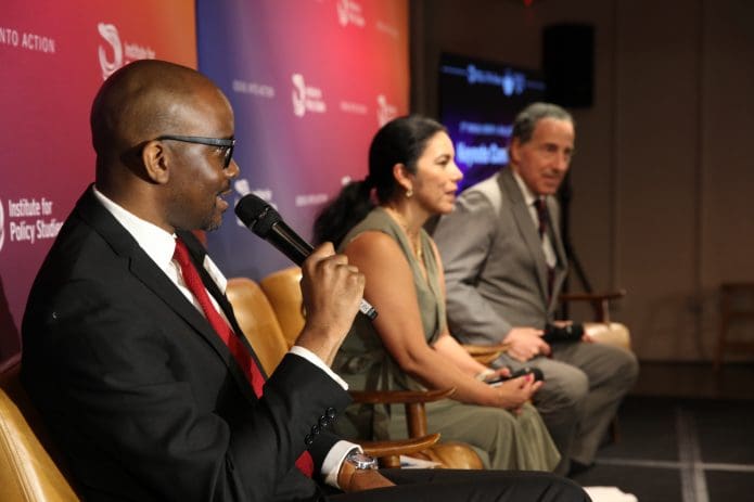 IPS Executive Director Tope Folarin talks with Sulma Arias and Rep. Jamie Raskin at the third annual IPS Henry A. Wallace Symposium (photo by Rick Reinhard for IPS)