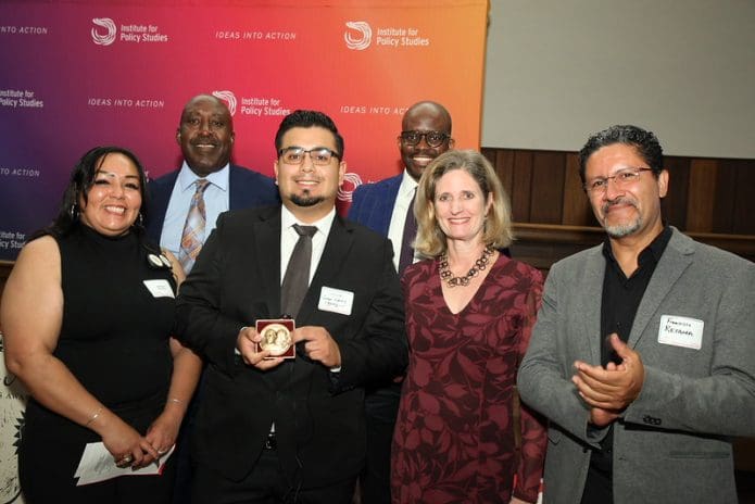 Members of La Liga, with IPS Executive Director Tope Folarin and union allies from the United States, accept the 2026 International Letelier-Moffitt Human Rights Award. (Photo by Rick Reinhard for IPS)
